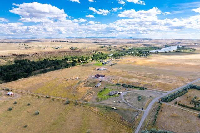 birds eye view of property with a rural view