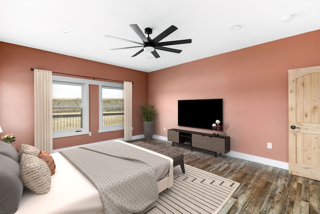 bedroom featuring ceiling fan and dark hardwood / wood-style flooring