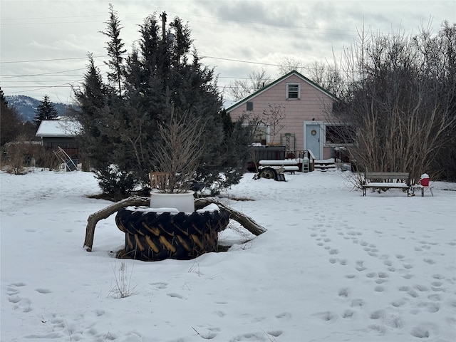 view of yard layered in snow