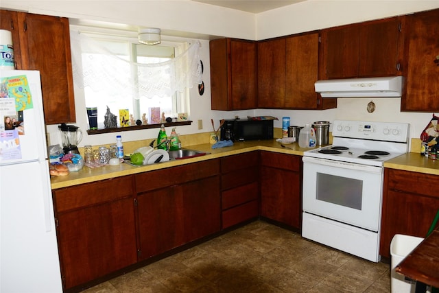 kitchen with sink and white appliances