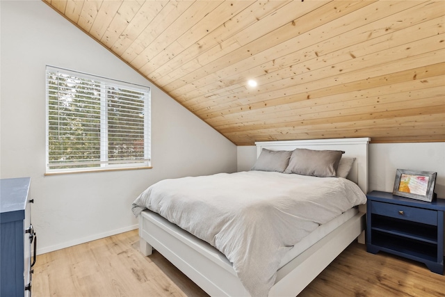 bedroom with lofted ceiling, wood ceiling, and light wood-type flooring