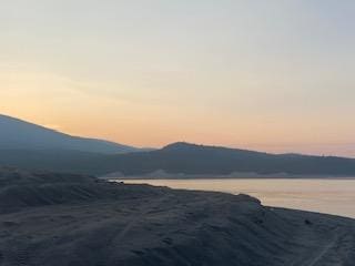 property view of mountains featuring a water view