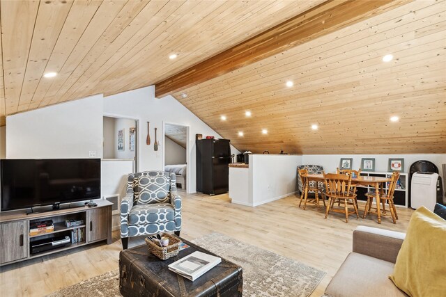 dining room with vaulted ceiling, wood ceiling, and light hardwood / wood-style floors