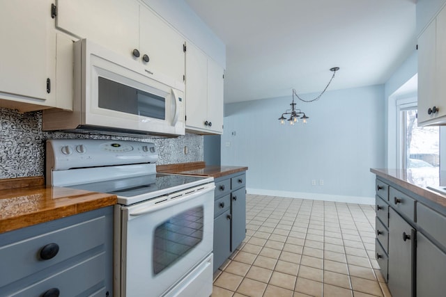 kitchen featuring pendant lighting, butcher block countertops, white cabinetry, backsplash, and white appliances