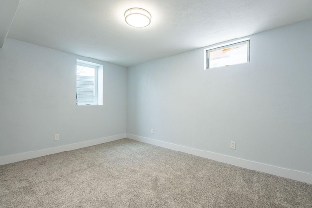 basement with carpet flooring and a wealth of natural light