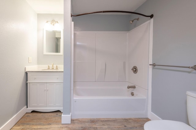 full bathroom featuring washtub / shower combination, vanity, toilet, and hardwood / wood-style floors