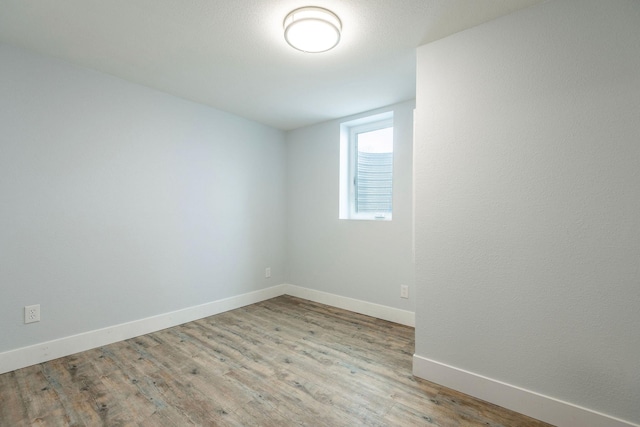 spare room featuring light hardwood / wood-style floors