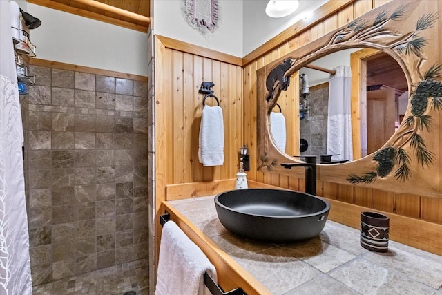 192 Crystal Lakes Dr, Eureka, MT 59917 - full bathroom with tiled shower, vanity, and wooden walls