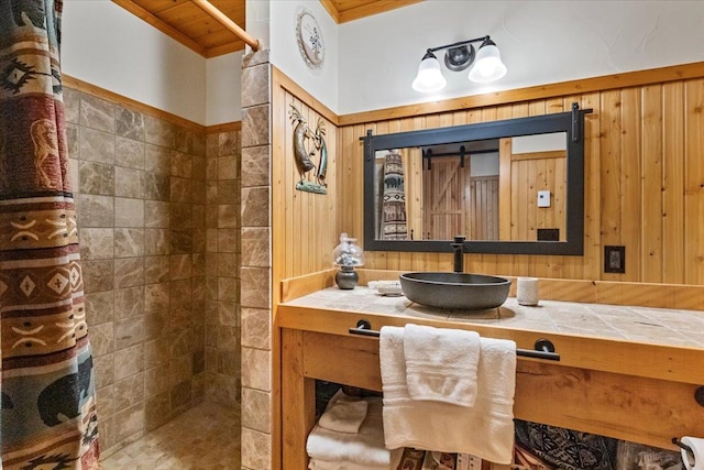 192 Crystal Lakes Dr, Eureka, MT 59917 - bathroom featuring tiled shower, vanity, and crown molding