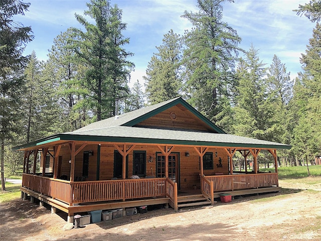 192 Crystal Lakes Dr, Eureka, MT 59917 - view of front facade featuring covered porch and roof with shingles