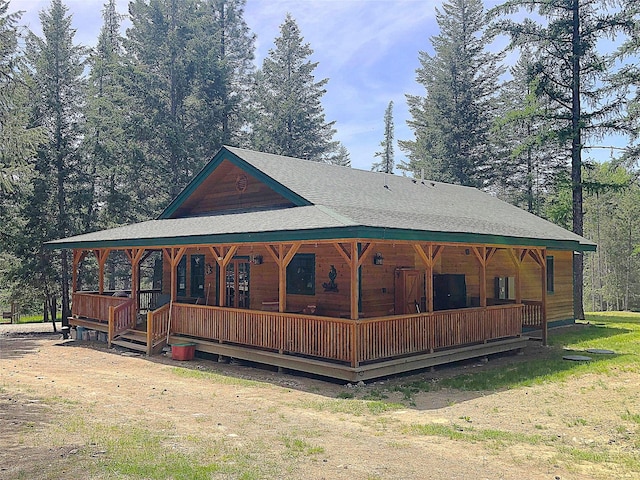 192 Crystal Lakes Dr, Eureka, MT 59917 - view of front of home featuring a porch and roof with shingles