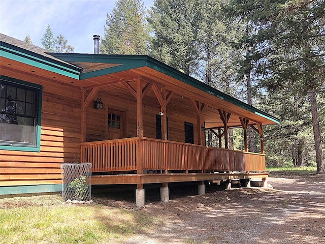 192 Crystal Lakes Dr, Eureka, MT 59917 - rear view of house featuring a porch