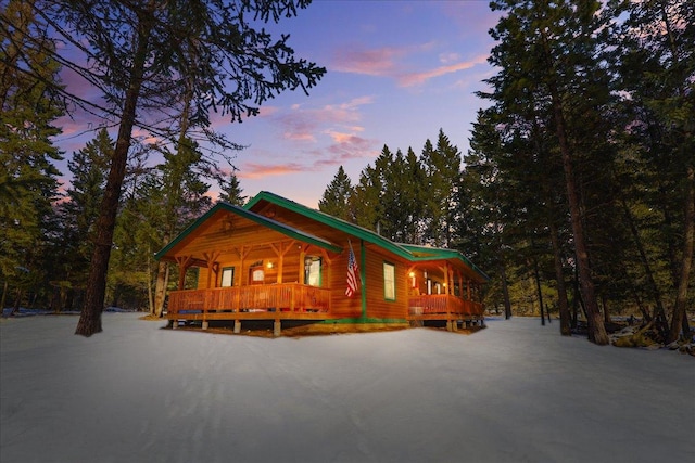 192 Crystal Lakes Dr, Eureka, MT 59917 - view of front of house featuring covered porch