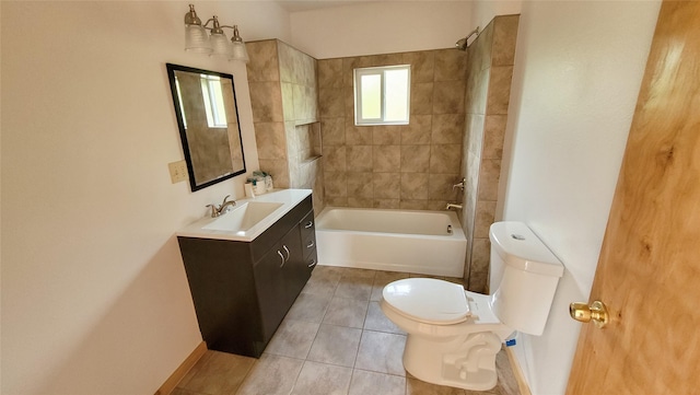 full bathroom with tiled shower / bath, vanity, toilet, and tile patterned flooring