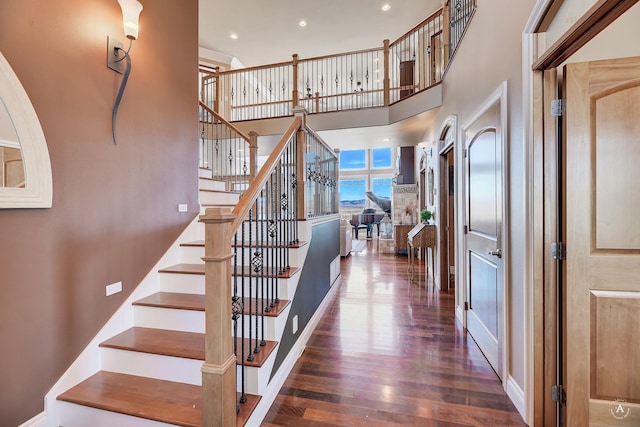 4428 Fox View Loop, Helena, MT 59602 - staircase with wood finished floors, a high ceiling, and recessed lighting