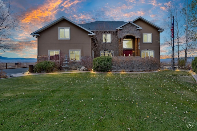 view of property with a yard