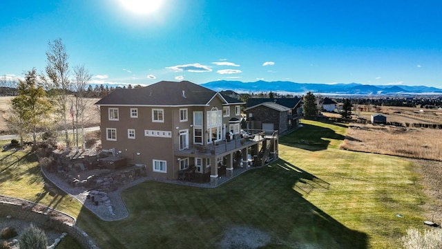 birds eye view of property featuring a mountain view