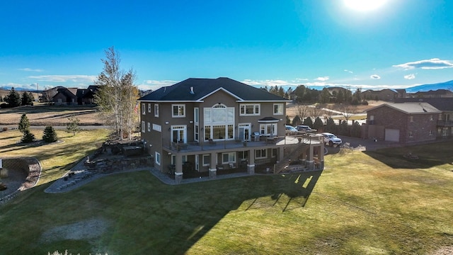 rear view of house with a lawn