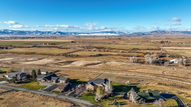 birds eye view of property with a mountain view and a rural view