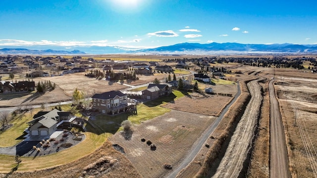 birds eye view of property featuring a mountain view