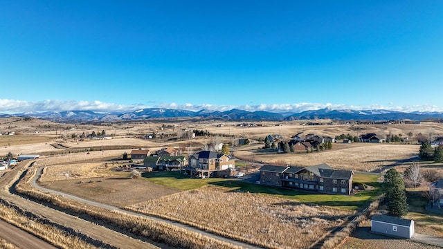 aerial view with a mountain view and a rural view