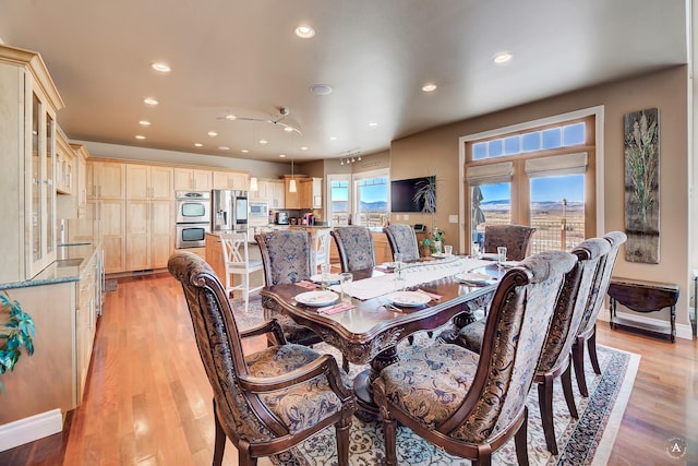 dining room with light wood-type flooring