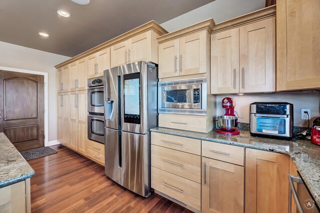 4428 Fox View Loop, Helena, MT 59602 - kitchen featuring appliances with stainless steel finishes, light brown cabinets, dark wood-style flooring, and recessed lighting