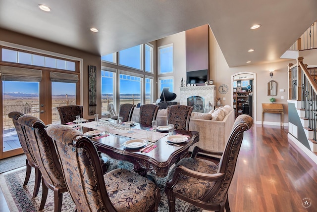 4428 Fox View Loop, Helena, MT 59602 - dining room with stairs, recessed lighting, french doors, wood finished floors, and a fireplace