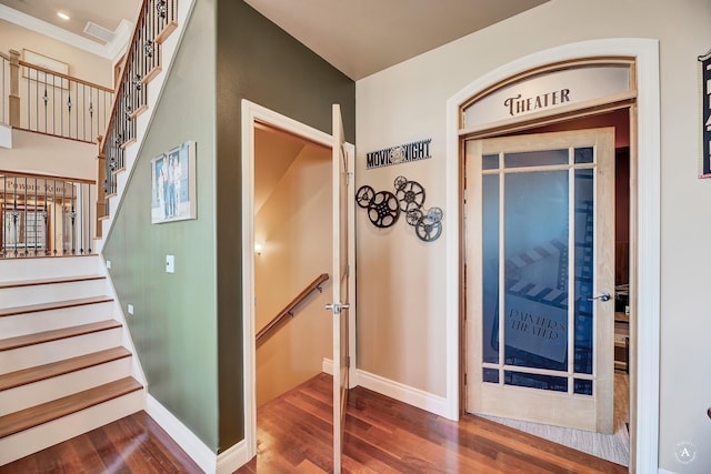 staircase featuring wood-type flooring