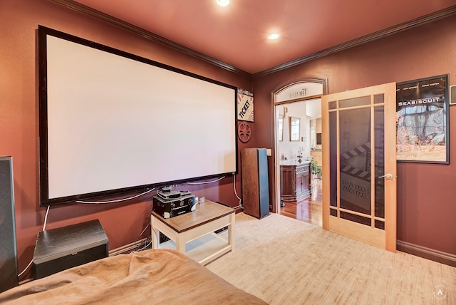 home theater room featuring ornamental molding