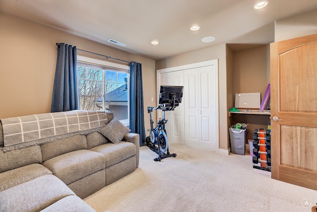 exercise room with carpet flooring