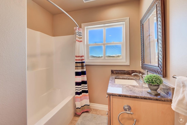 bathroom featuring shower / tub combo with curtain, tile patterned floors, and vanity