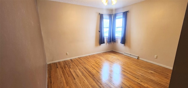 unfurnished room with hardwood / wood-style floors