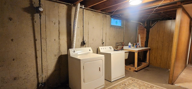 clothes washing area with sink and washing machine and dryer