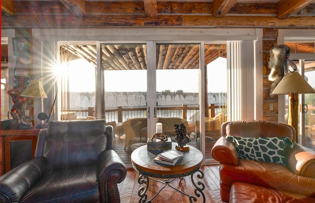 living room with wood-type flooring and beamed ceiling