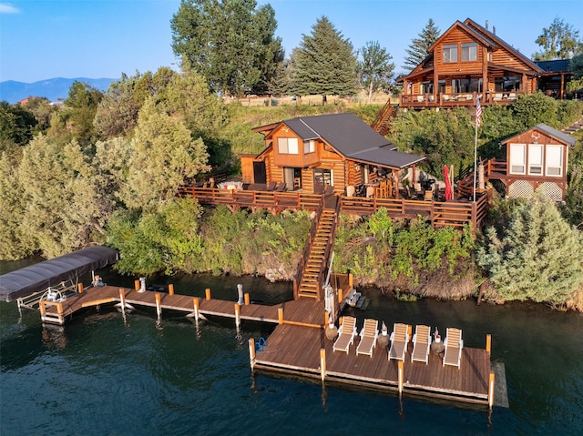 dock area featuring a deck with water view