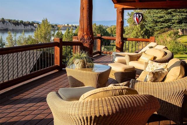 wooden deck featuring a water view