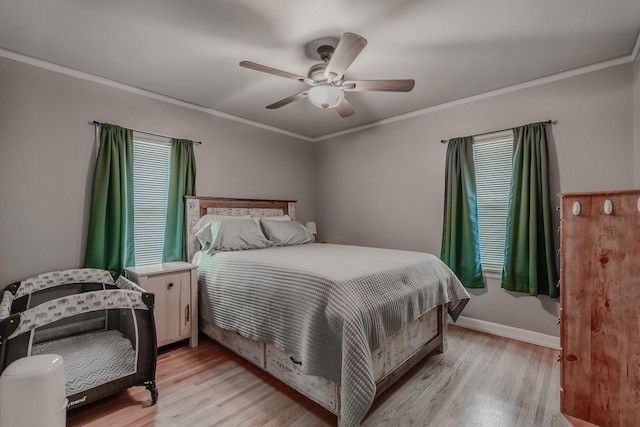 bedroom featuring crown molding, ceiling fan, and light hardwood / wood-style floors