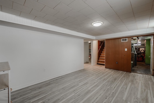 basement featuring light hardwood / wood-style flooring