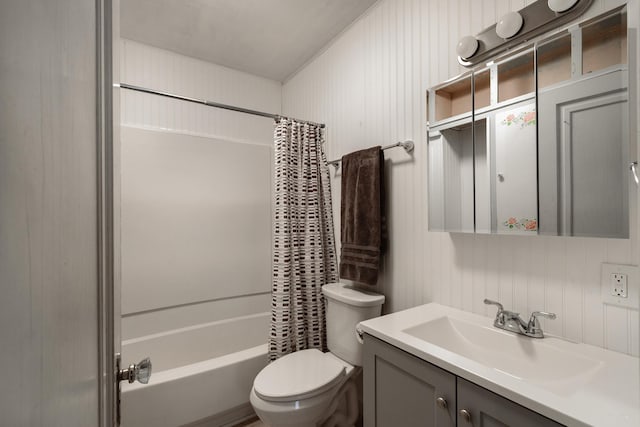 full bathroom featuring vanity, shower / bathtub combination with curtain, and toilet