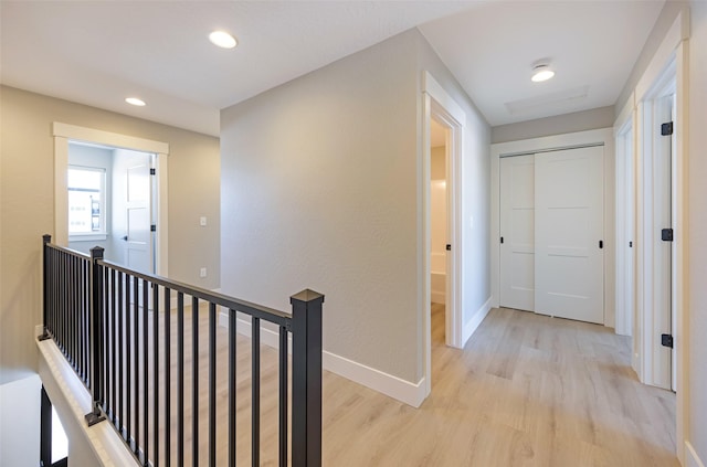 corridor with light wood-type flooring