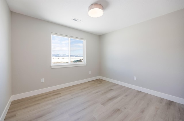 unfurnished room featuring light wood-type flooring