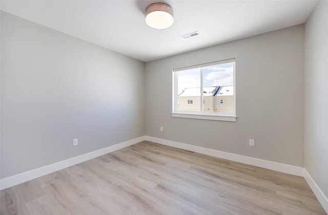 spare room featuring light hardwood / wood-style floors