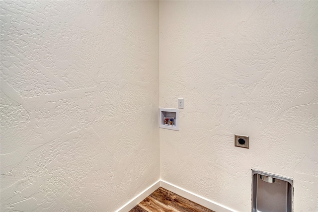 washroom with electric dryer hookup, hardwood / wood-style floors, and hookup for a washing machine