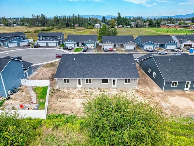 birds eye view of property featuring a mountain view