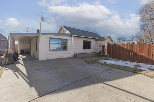 rear view of house with a carport