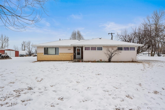 view of snow covered house