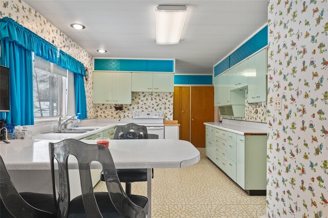 kitchen with white dishwasher and sink