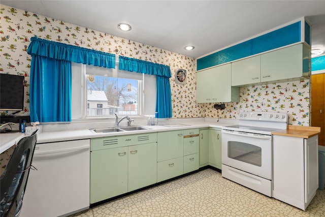 kitchen featuring sink and white appliances