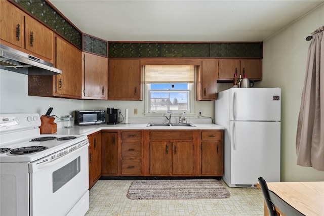 kitchen with white appliances and sink